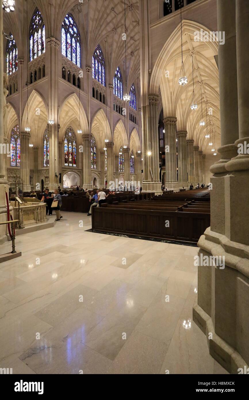 The nave of St. Patrick`s Cathedral. The St. Patrick's Cathedral in New York is the largest cathedral in the United States. It is located in Manhattan. Start of construction was the 15th of August 1858. It was built in neo-gothic style. Manhattan, New York | usage worldwide Stock Photo